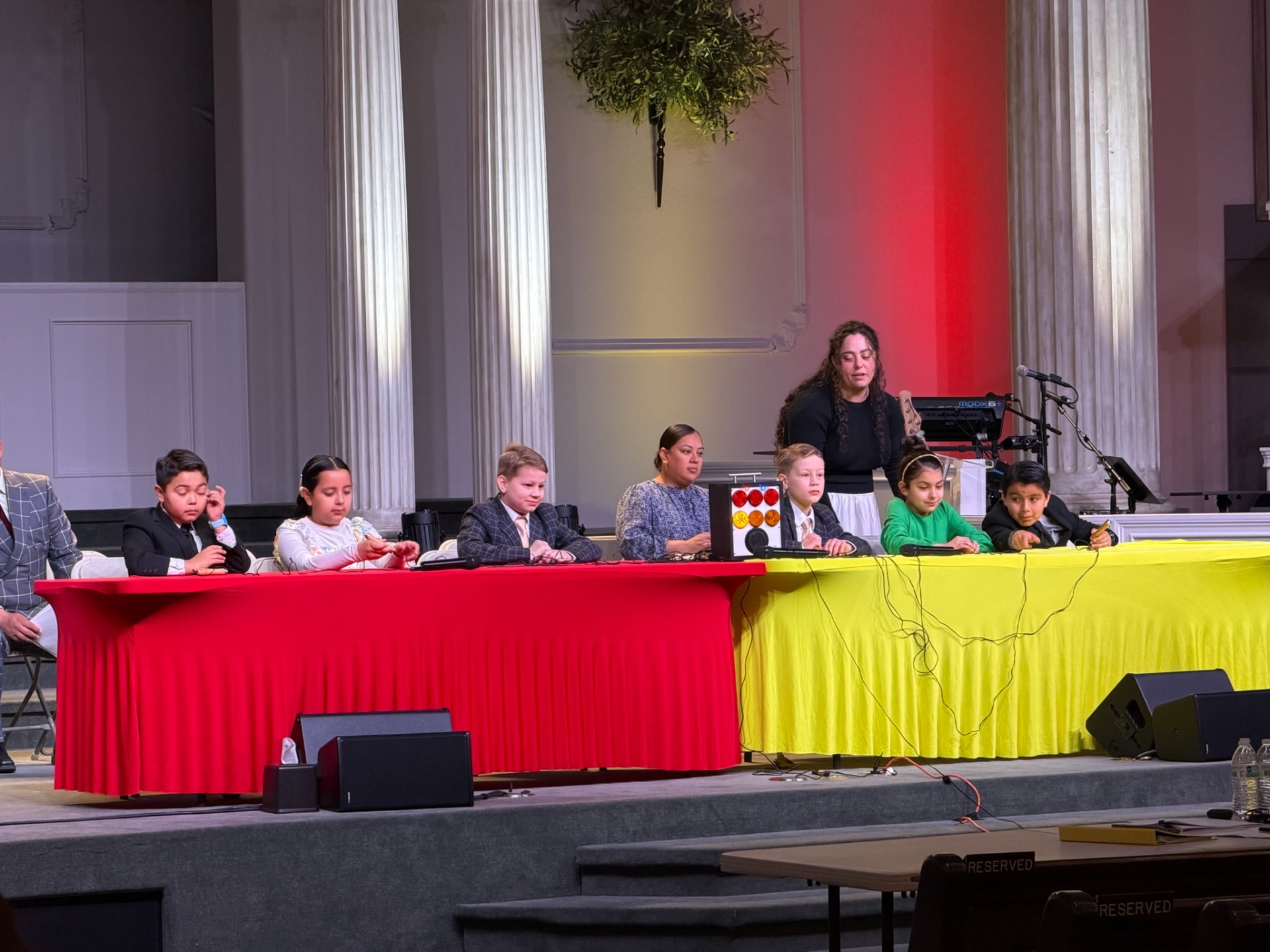 Quizzing team holding green trophy