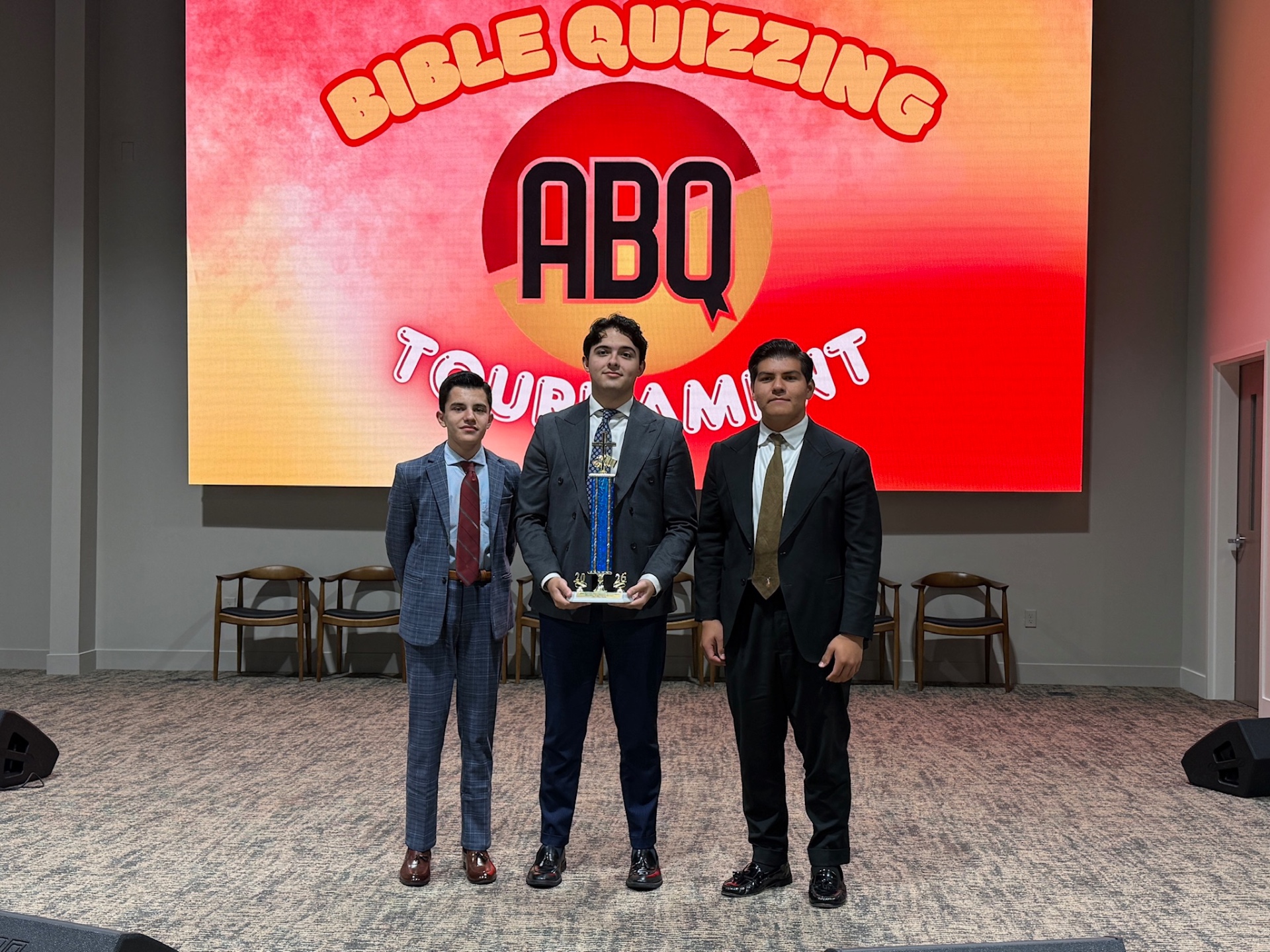 Bible quizzing tournament champions with trophy